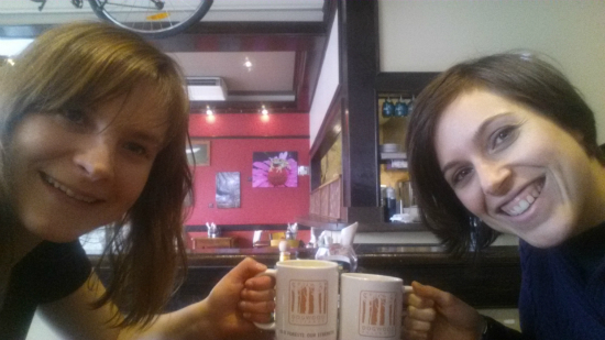 Dogwood staffers Kimala & Amanda enjoy a cup of organic coffee in Dogwood mugs at Green Sage!